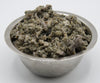 a bowl of raw green tripe to be served as dog food